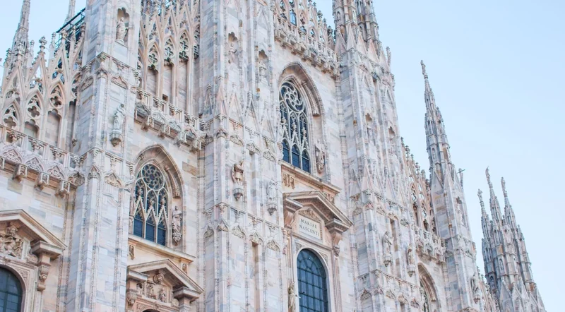 Close marble facade details and windows on the Duomo di Milano